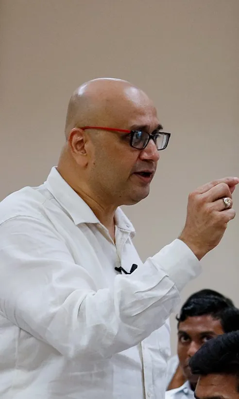 A mentor speaking to students at SSSIHL