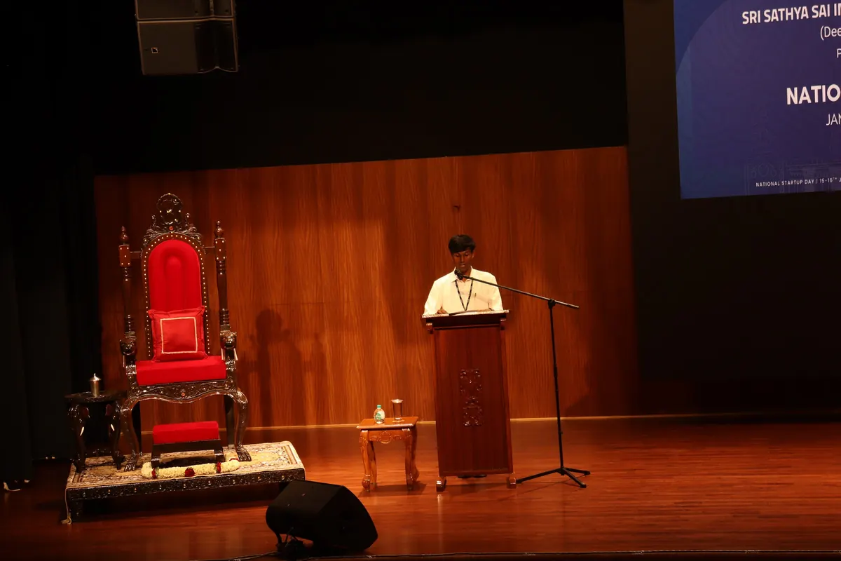 A student pitching at the podium at Startup Day