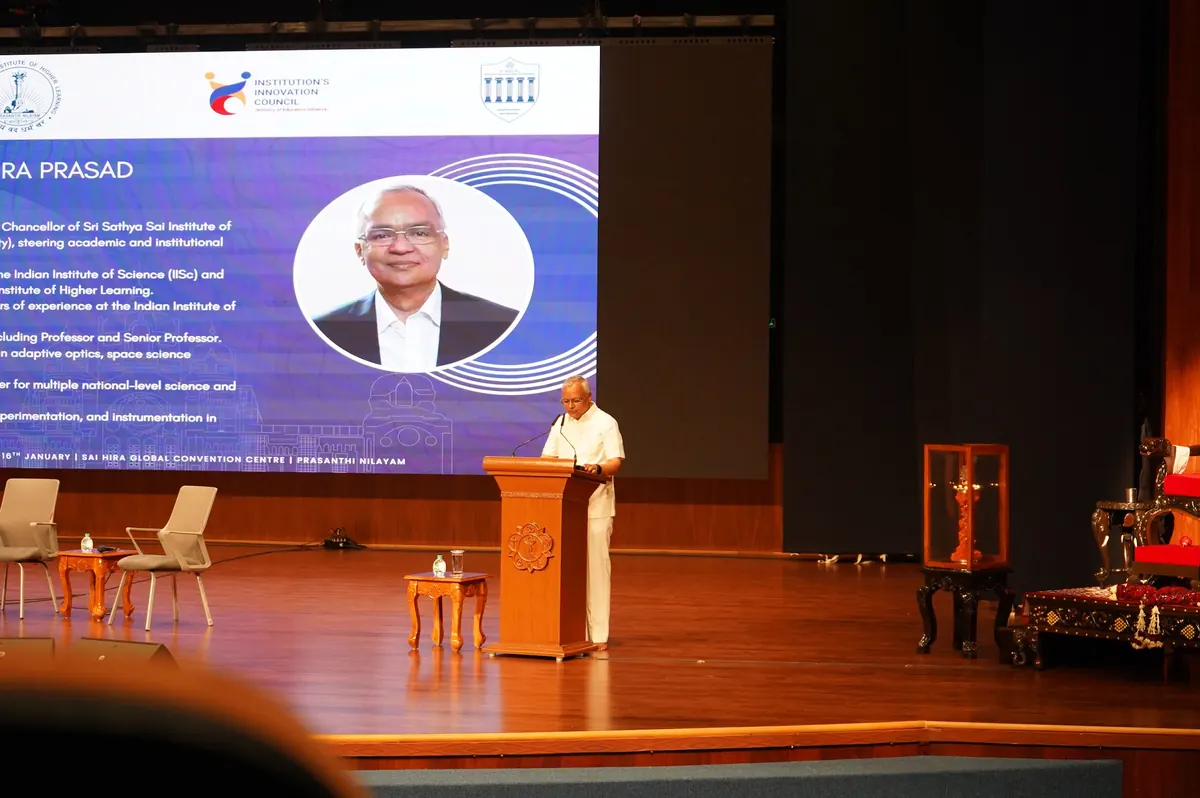 The Vice-Chancellor at the podium with his introduction on screen